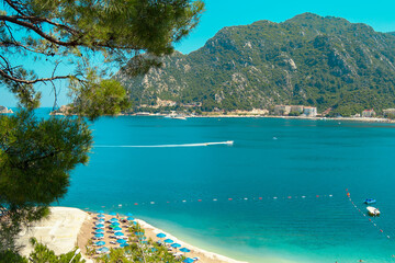 Naklejka premium Mediterranean coast, beaches of the city of Marmaris. Turkey. Sunny bright day on the beach. Rest and travel to the sea.