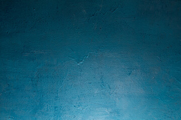 Painted different shades of blue on the wall. Abstract blue background