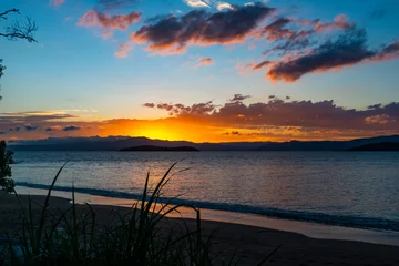 Foto op Plexiglas The lush colors of the sunset at Ponta do Sambaqui beach in Florianópolis, Santa Catarina, Brazil. © BY BRAZIL