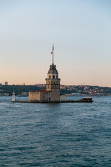 Maiden Tower, Kiz Kulesi on the Asian side of Istanbul at sunset in the middle of Bosphorus, Turkey. One of the symbols of Istanbul. Ancient lighthouse of the Ottoman period. Girl tower. Vertical phot