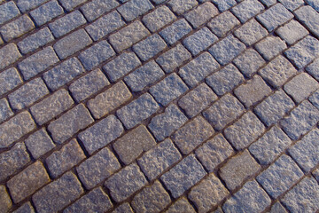 pattern brown color of old granite stone wall uneven cracked real stone wall surface with cement