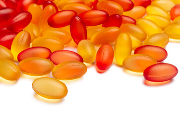 Omega3 and Vitamin D3. A scattering of tablets. Medicine capsules.
