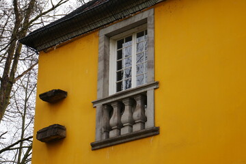 wooden window with french balcony of a building from the rococo late baroque