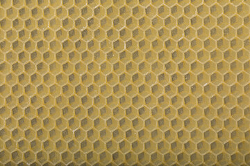 Yellow empty bees wax background with cells in close up