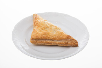 Crispy chicken patty triangle shape on white plate