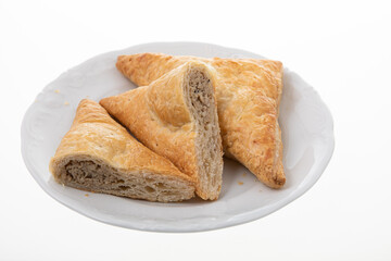 Crispy chicken patties triangle shape on white plate