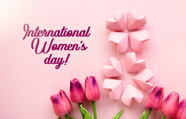 Happy Internationa Women's Day greeting card on delicate pink background  