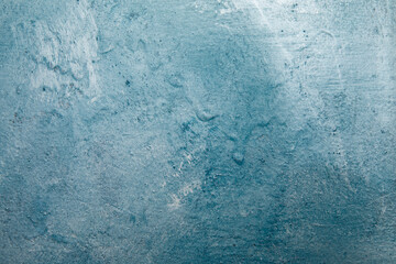 Painted different shades of blue on the wall. Abstract blue background