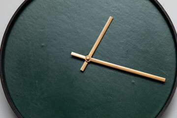 Green wall clock with golden indicators