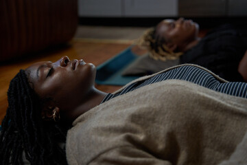 Black women enjoy peaceful sound bath meditation