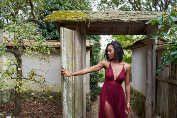 Black woman explores outdoor nature garden