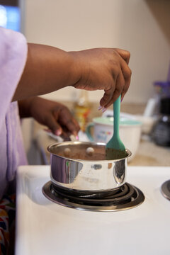 Black Woman Making Hot Chocolate At Home