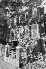 small red brick houses in the Union street in Brooklyn, New York with typical facade