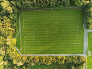 Aerial drone view on a small soccer pitch. Football training ground from above view. © mark_gusev