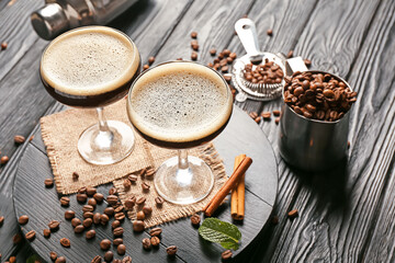 Glass of coffee martini on dark wooden background