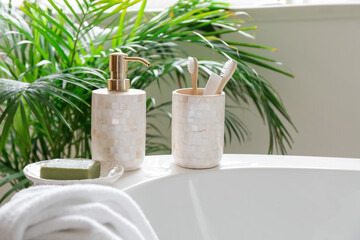 Soap with toothbrushes in interior of bathroom