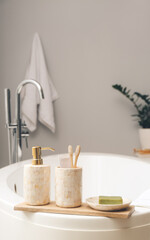 Soap with toothbrushes in bathroom