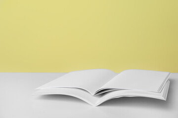 Open blank magazines on table