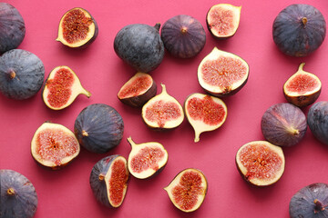 Composition with fresh figs on color background