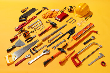 Set of construction tools on color background