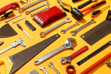 Set of construction tools on color background