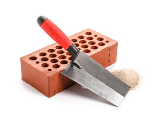 Spatula with brown brick on white background