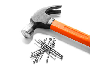 Hammer with nails on white background