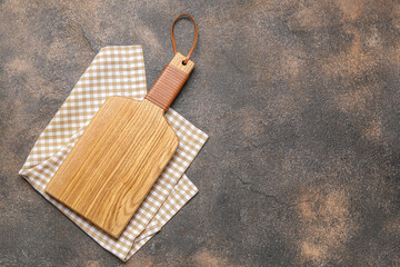 Fototapeta premium Wooden cutting board on grunge background