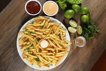 Portion of fries.Portion of fries. Lettuce, potato, green onion, tomato, ketchup and mayonnaise Lettuce, green onion, tomato, ketchup and mayonnaise