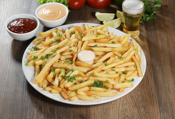 Portion of fries.Portion of fries. Lettuce, potato, green onion, tomato, ketchup and mayonnaise Lettuce, green onion, tomato, ketchup and mayonnaise