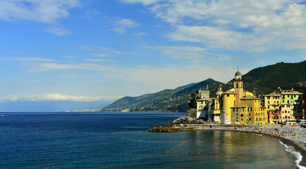 Fototapeta na wymiar Basilica di Santa Maria in Town of Camogli on the Background of the Ligurian Coast