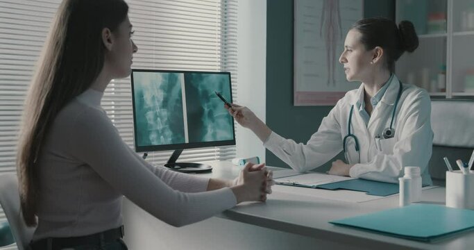 Doctor checking a patient's x-ray during a visit