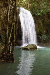 Fototapeta na wymiar Erawan waterfall at the Erawan National Park in Kanchanaburi, Thailand 