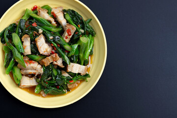 Stir fried chinese kale with crispy pork belly