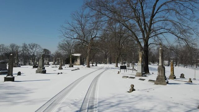 Old Cemetery with Monuments during winter with snow
