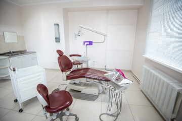 Modern dental practice. Dental chair and other accessories used by dentists.