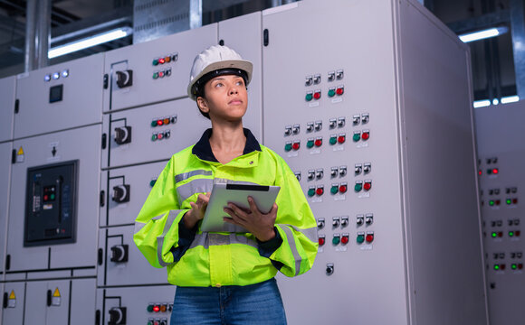 Engineer checking and inspecting at MDB panel , working with electric switchboard to check  medium Voltage Switchgear working in Main Distribution Boards factory.