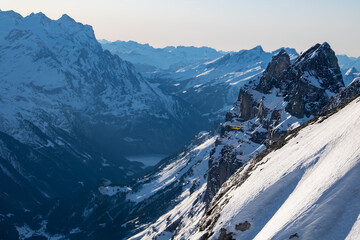 Fototapeta na wymiar view of the snowy alps with a little plan 