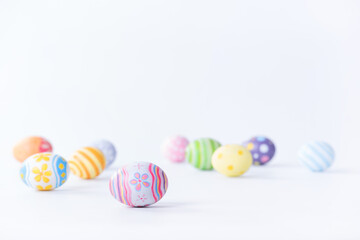 Fototapeta na wymiar Happy Easter day colorful eggs and blurred on white background with copy space