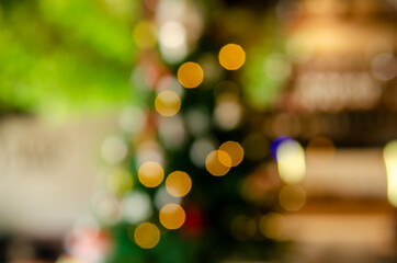 Christmas and Happy new year on blurred bokeh with snowfall banner background.