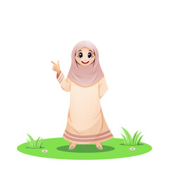 Cute Muslim girl standing in the grass and pointing his finger up