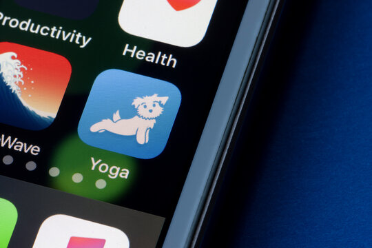 Portland, OR, USA - Mar 1, 2021: Down Dog Yoga app icon is seen on an iPhone. Down Dog is a popular mobile yoga training platform designed to engage users to practice yoga.