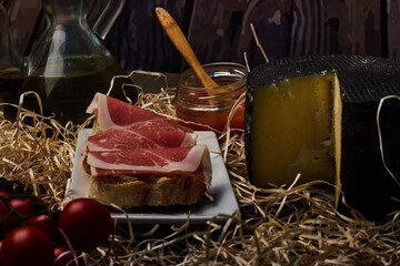 local products Still life of Serrano ham with tomatoes and olive oil