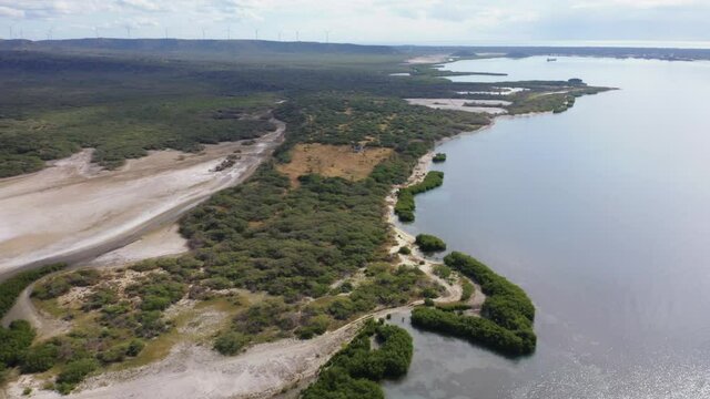 drone fly over sabana buey with dune and sand beach over the ocean in bani dominican republic