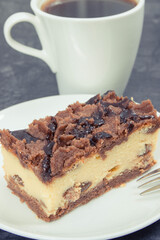 Fresh cheesecake on white plate and black coffee. Delicious dessert for different occasion