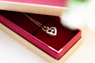 Gold chain. A romantic gift. Heart shaped pendant. Gift in a box
