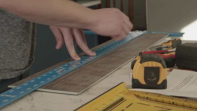 Marking flooring with T square