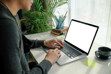 Cropped shot of young man freelancer concentrate working on laptop computer.