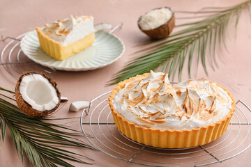 Tasty coconut pie on color background