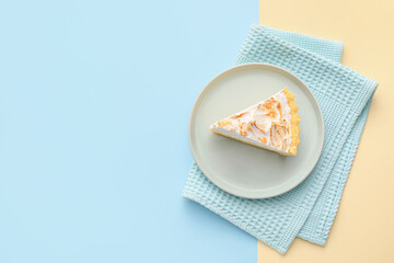 Plate with piece of tasty coconut pie on color background